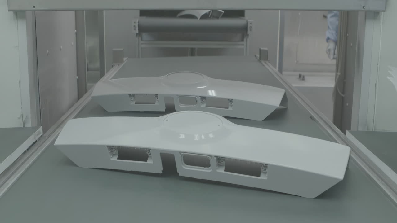 The automated process polishes the painted surface of a car with a pneumatic polishing machine. Waxing Car in production line Factory plant