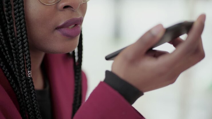 Close up shot of Afro-American young girls hand holding phone