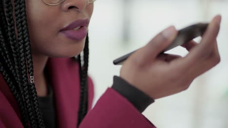 close up shot of afro-american young girls hand holding phone