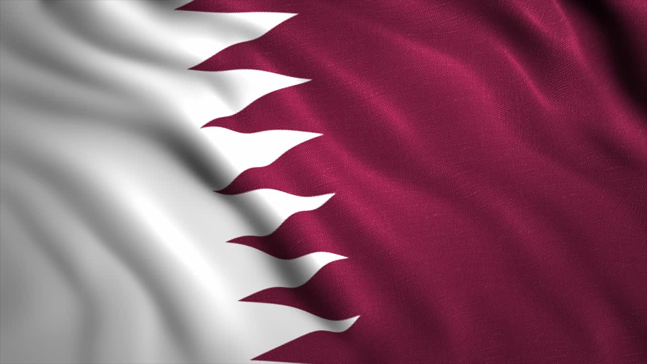 La bandiera del Qatar, un rettangolo bordeaux con una linea frastagliata bianca sul lato dell'asta