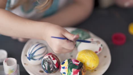 a close up video of the egg painting process