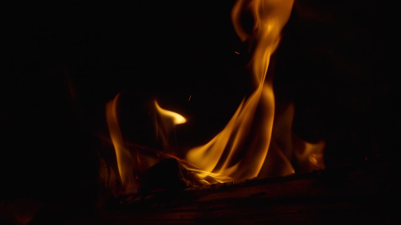 Close up of campfire flames burning in slow motion