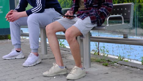 Young-Man-Phone-Sitting