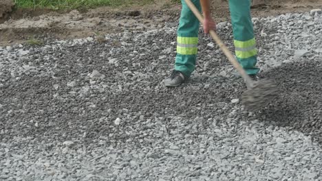 worker with shovel at construction works