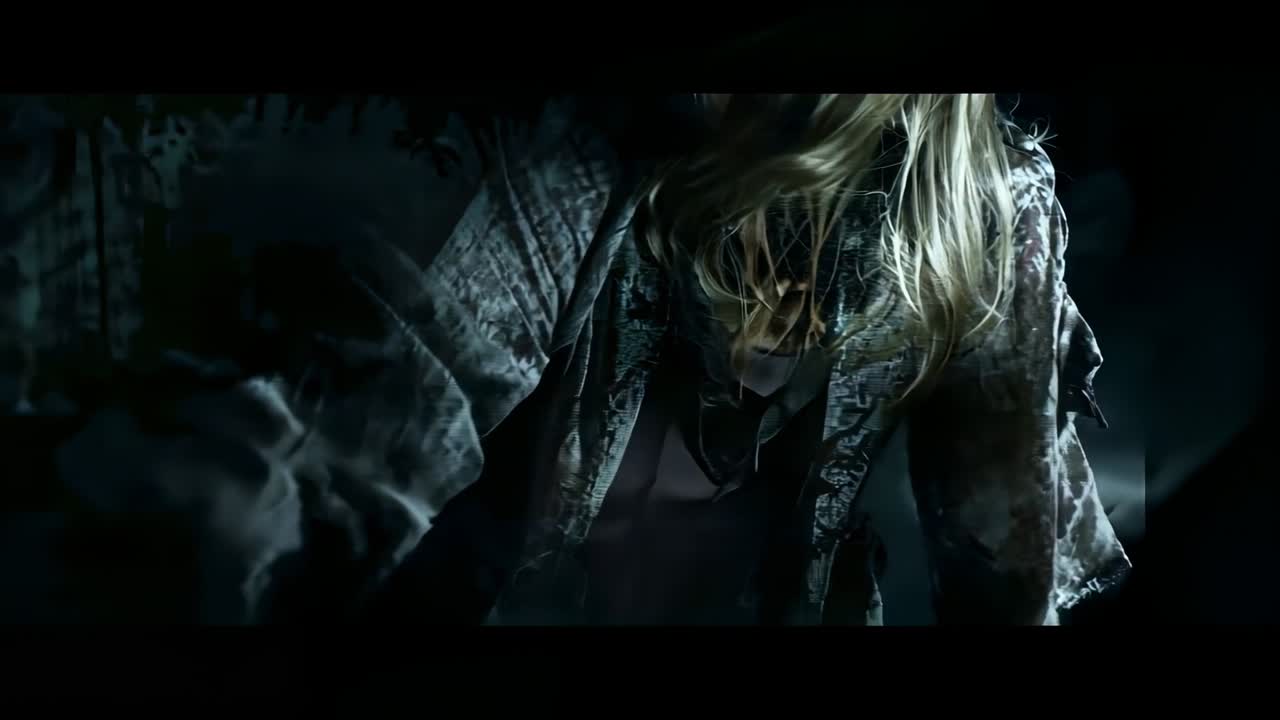 Blonde figure lifting head in dim room as purple-blue glitch lines sliding across camo jacket