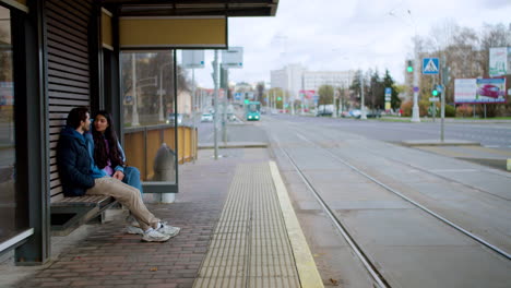 couple at tram stop