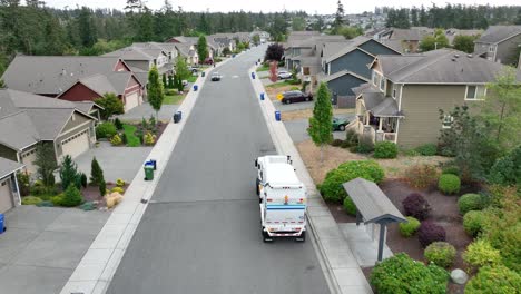 Aerial-shot-following-a-dump-truck-as-it