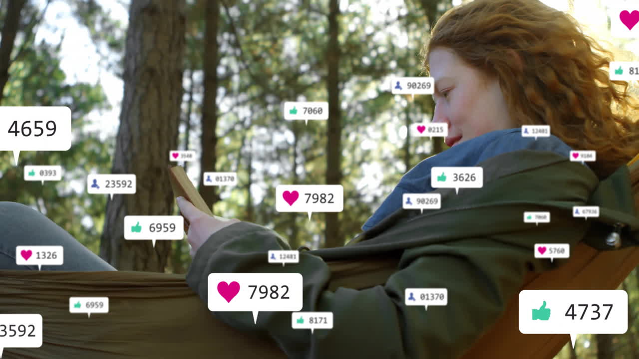 Woman reclining in forest hammock interacting with smartphone, social media icons hovering around