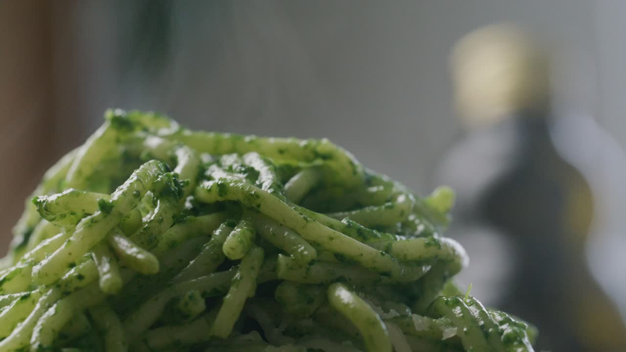 Hot Pasta in Green Spinach Sauce Served on Plate