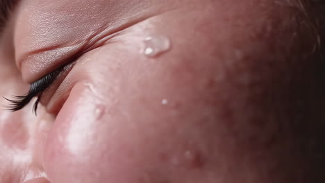 close-up of a person's face with sweat
