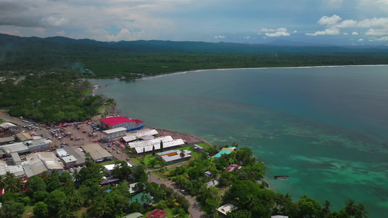 Sundaun Market fish Wewak costal city town Boram road Dogreto Bay aerial drone Wewak Hill capital East Sepik Region Province Papua New Guinea PNG summer sunny morning dry season cars traffic backwards