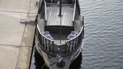 old wooden pirate ship for touring on jelgava river moored, latvia