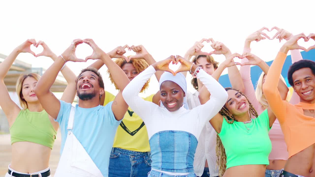 Diverse Group of People Making Heart Shapes with Their Hands