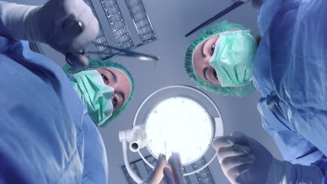 women performing surgery in hospital together