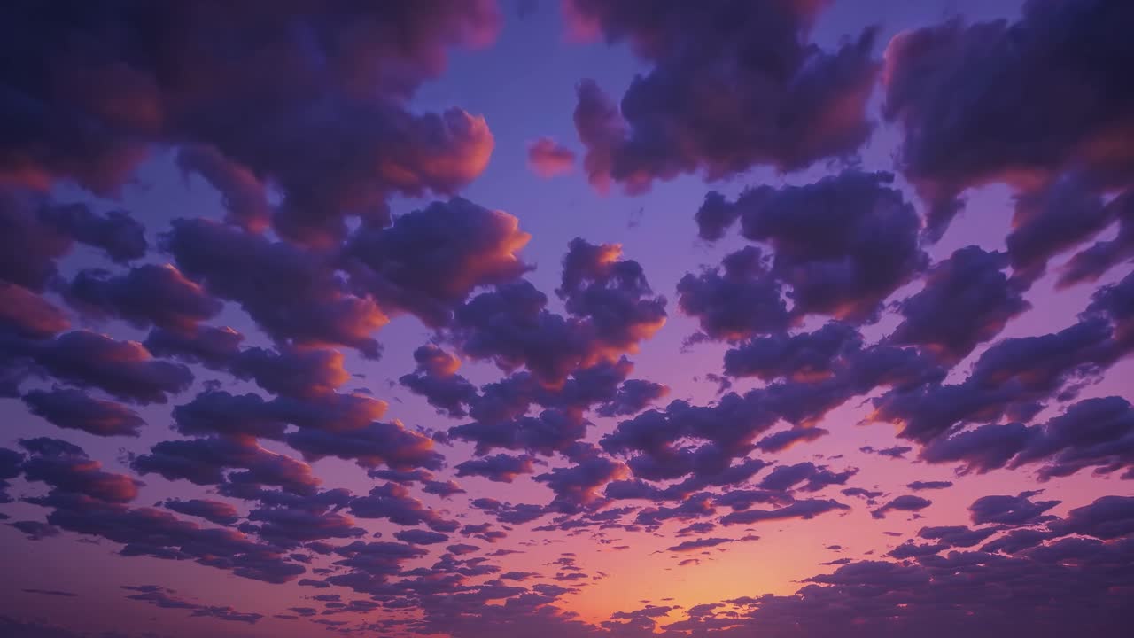 A mesmerizing video of a sunset sky with scattered clouds, captured from a low angle