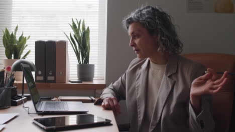 woman in a video call in a home office