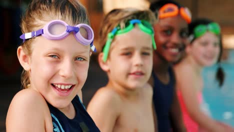 smiling students wearing swimming goggles