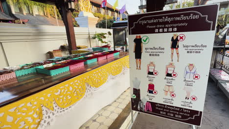 wat chedi luang varavihara temple dress code poster at the entrance