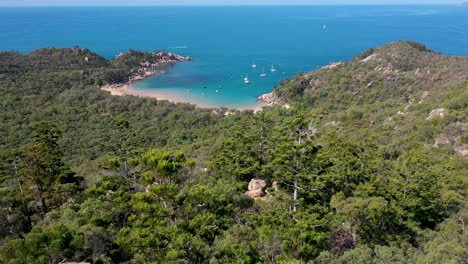 magnetic island landscape lookout aerial revealing arthur bay above boulders and trees, queensland