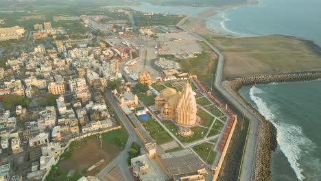 aerial view of a coastal city with a temple in india