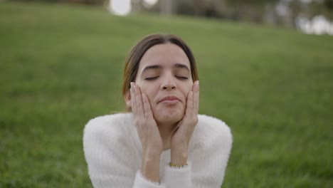 woman expressing different emotions in a park