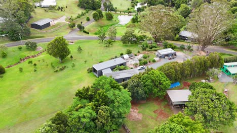 expansive property with lush greenery and buildings