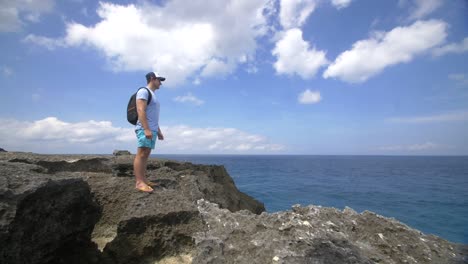 tourist standing on a rocky outcrop