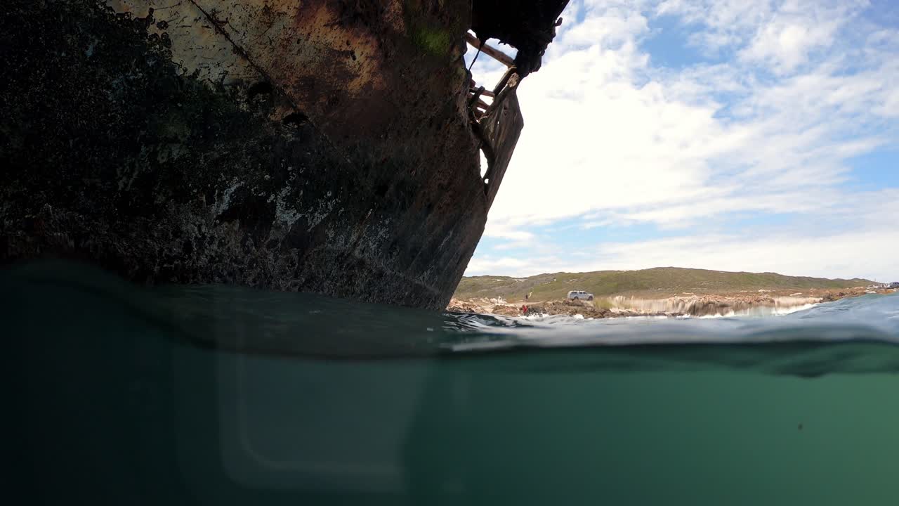 Close up of Meisho Maru Shipwreck hull at Cape Agulhas southernmost tip of South Africa, Low water surface shot