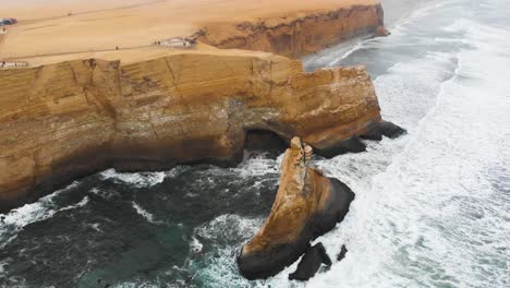 orbital shot of tourist view point at the edge of the cliff in the paracas national park