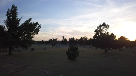 aerial shot through a graveyard in georgia during sunset