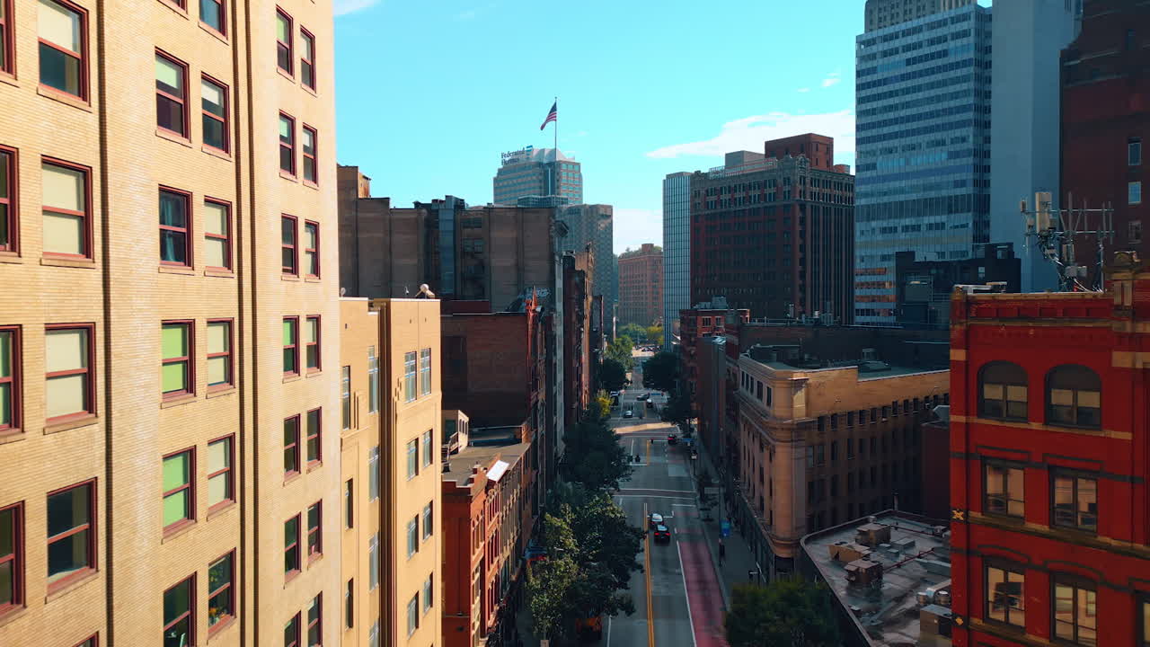 Pittsburgh, USA, 2 August 2025: Drone footage along the facades of the multi-storied buildings. View on the empty street of Pittsburg, Pennsylvania, USA