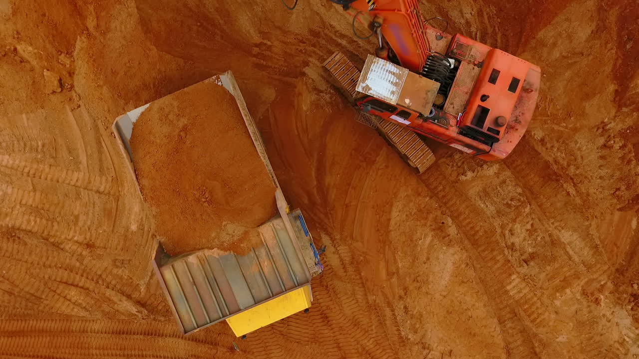 Sand work aerial view. Mining machinery at sand mine. Aerial view of mining sand