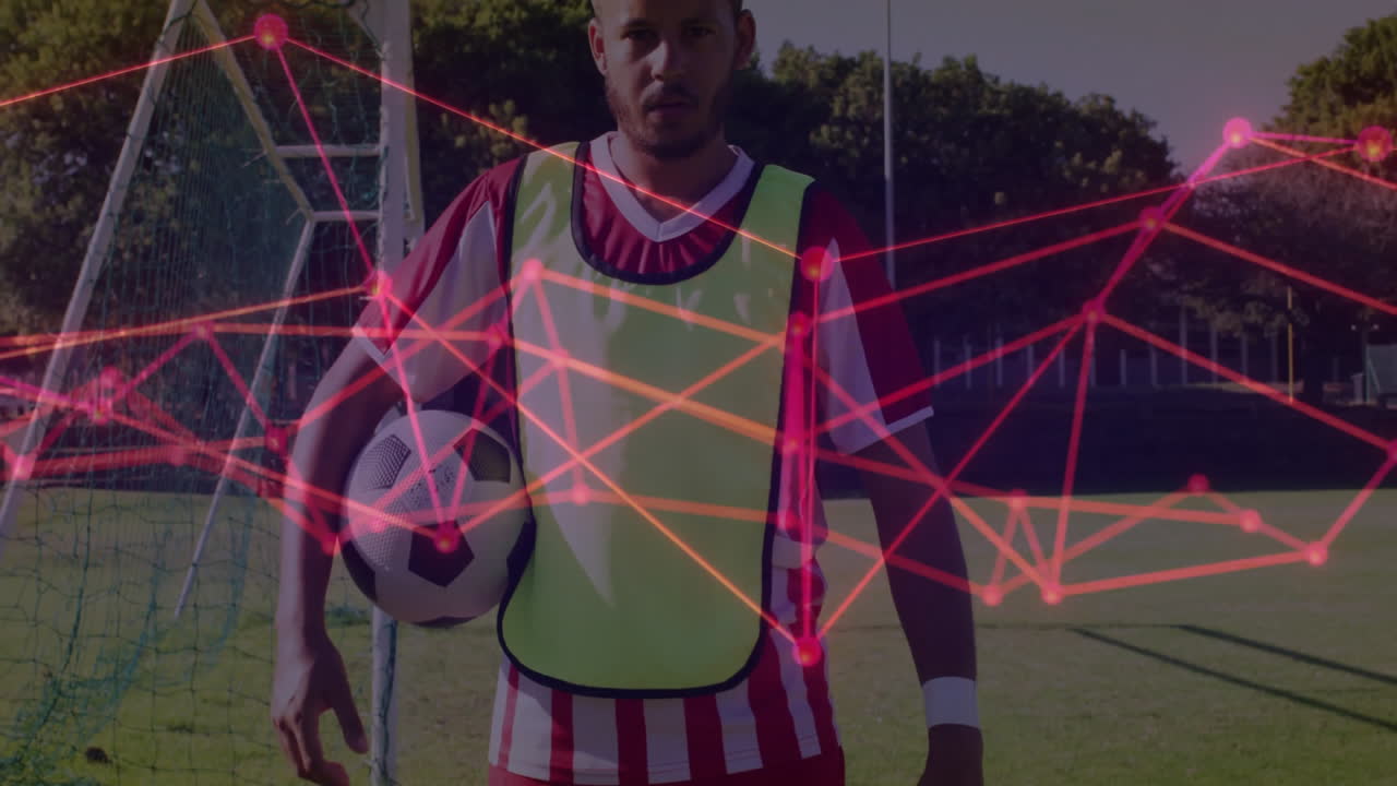 Soccer player holding ball with network connections animation over field
