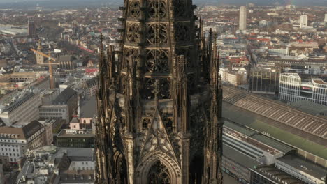 Aerial-ascending-footage-of-beautiful-historic-towers-of-Cologne-Cathedral.-Gothic-religious-landmark.-Cologne,-Germany