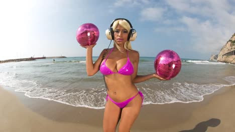 woman dancing on beach disco balls 0