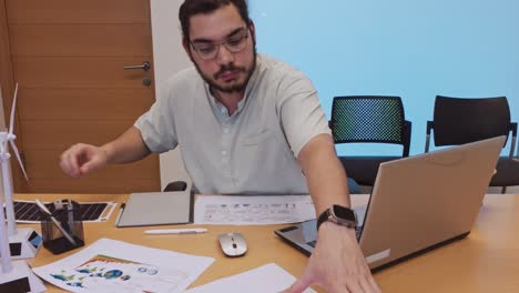 thoughtful project manager contemplating data for a renewable energy plan