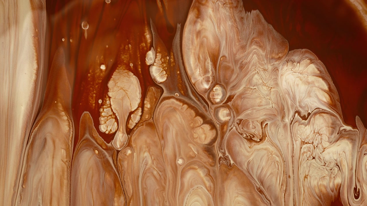 Brown liquid colors flowing on surface