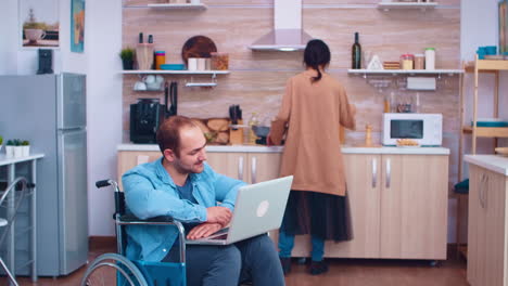 Disabled-man-waving-on-video-conference