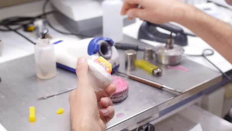 a dentist making a dental mold