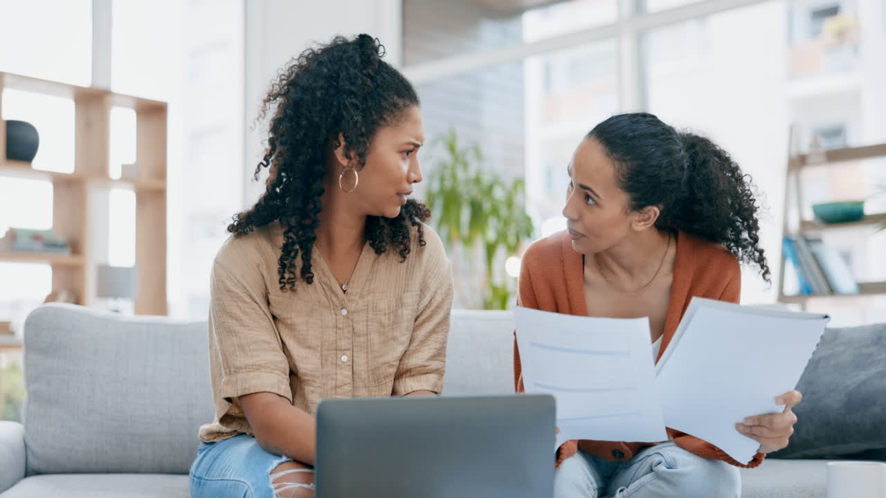 Lesbian couple, laptop and paperwork in finance