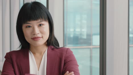 portrait asian business woman smiling looking confident independent female in office executive enjoying successful career in corporate leadership company manager at work