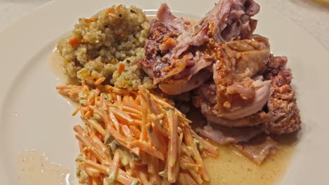 Closeup-shot-of-Pork-with-salad-and-corn-served-on-a-plate