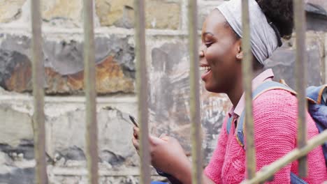 African-american-using-her-smartphone-in-street