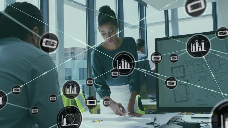 Animation of connected icons over diverse architects discussing blueprint in office