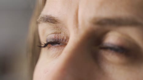 close-up female eyes with blue eyes.