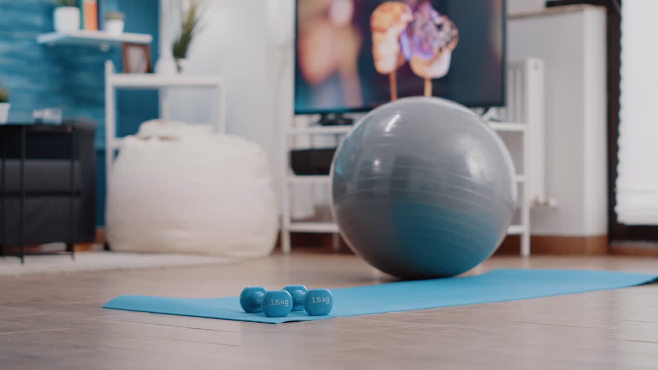 Nobody in living room with sport and workout equipment