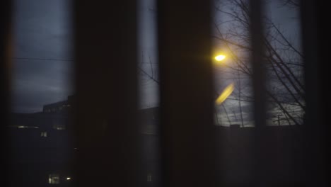 street light at night through apartment window