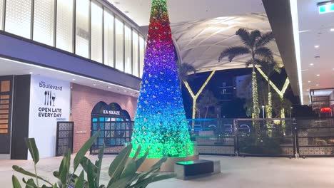 colorful christmas tree lights up shopping area