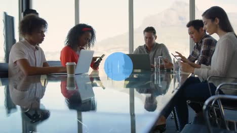 animation of network of icons over team of diverse colleagues using electronic devices at office