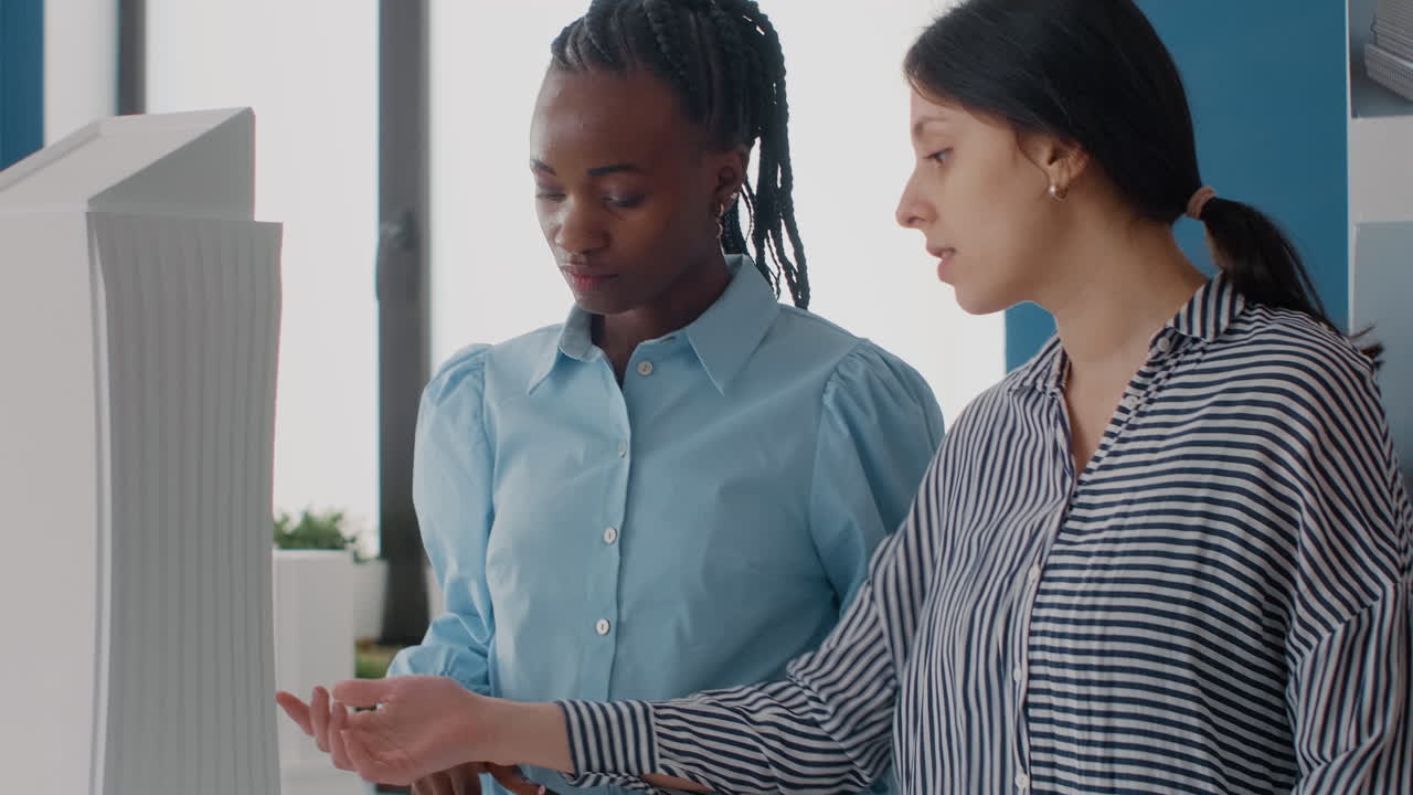Architects Collaborating on a Building Model